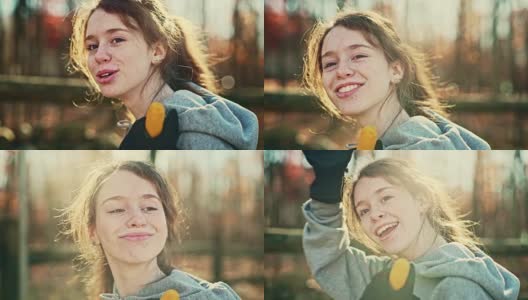 16岁的漂亮女孩的视频肖像谁在户外，在后院，在秋天。高清在线视频素材下载