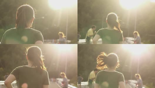 超级慢镜头:一位年轻女子在夕阳下慢跑高清在线视频素材下载