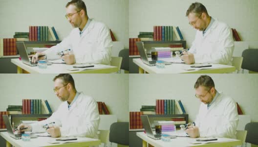 一位医生在他的办公室里写一份报告。研究开发现代疫苗高清在线视频素材下载