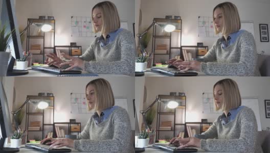 年轻女性晚上在家用笔记本电脑工作高清在线视频素材下载