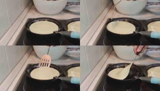 做煎饼。铸铁煎锅上的传统俄罗斯布林。高清在线视频素材下载