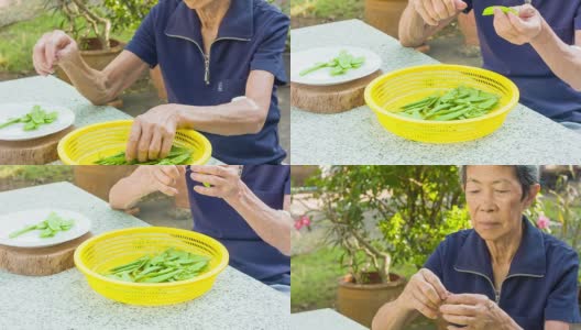 在花园里做饭的亚洲女人高清在线视频素材下载