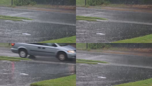 雨水从柏油路上溅起一大滩水花高清在线视频素材下载