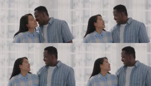 一个非裔美国人在家里亲吻妻子的前额。高清在线视频素材下载