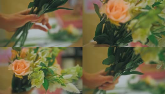 女花匠做花束，她剪包装纸在花店工作。可爱的年轻专业人士在花店做花束高清在线视频素材下载