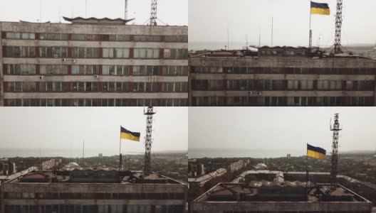 宁静的马里乌波尔城市景观。马里乌波尔市中心行政大楼的鸟瞰图，上面有乌克兰国旗高清在线视频素材下载