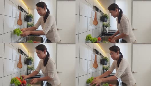 中年妇女清洗蔬菜抗病毒高清在线视频素材下载