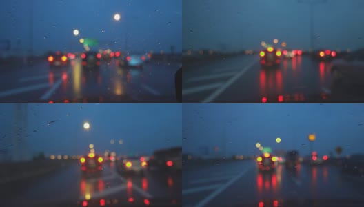 在黄昏下着雨的高速公路上开车，聚焦在车架上。高清在线视频素材下载
