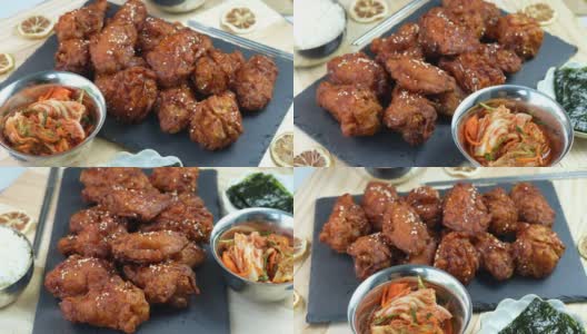 韩式炸鸡配辣酱传统的韩式食物，炸鸡配米饭和泡菜放在木桌上。高清在线视频素材下载