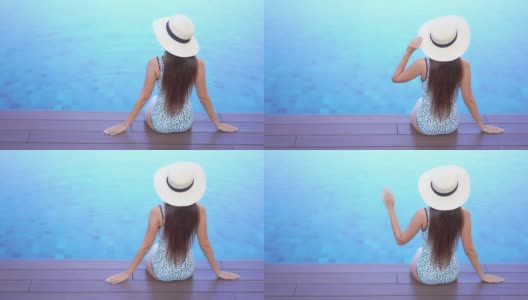 年轻的亚洲妇女放松愉快的户外游泳池高清在线视频素材下载