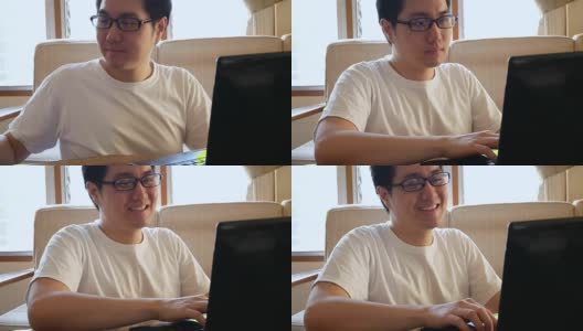 快乐的亚洲人在休闲衣服使用笔记本电脑和喝咖啡在客厅-室内场景高清在线视频素材下载