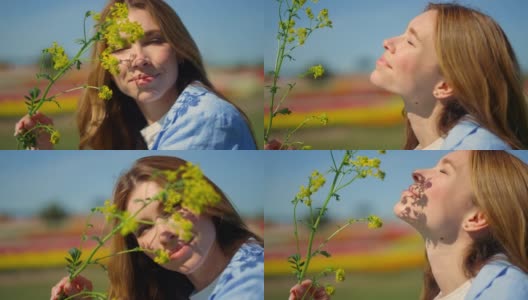美丽的女人的脸与春园外的油菜花枝叶交相辉映。高清在线视频素材下载