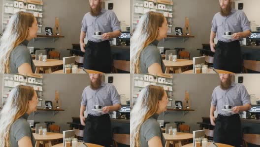 咖啡师在咖啡馆为快乐的顾客提供咖啡高清在线视频素材下载