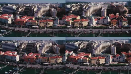 葡萄牙夸特拉市大西洋沿岸的酒店和私人住宅。从海边的无人机上拍摄。小径。夏天走了。度假胜地。高清在线视频素材下载