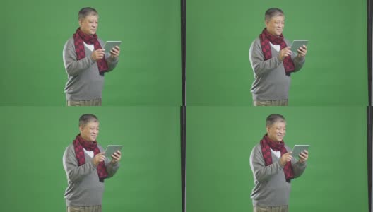 穿着灰色毛衣和红领巾的亚洲老人高清在线视频素材下载