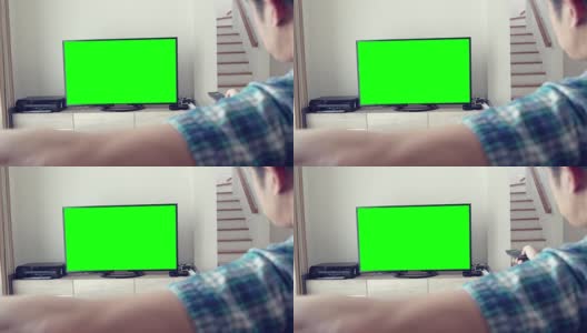 男人看绿屏幕电视高清在线视频素材下载
