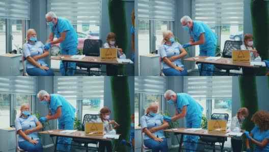 小女孩在医院里和护士玩耍，她的祖母正在准备COVID-19疫苗接种高清在线视频素材下载