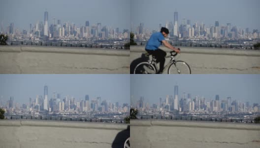 自行车穿过纽约/JC天际线全景高清在线视频素材下载