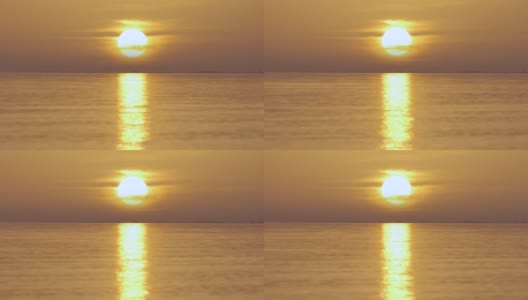 巨大的黄色太阳从海面升起。高清在线视频素材下载
