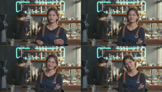 4K亚洲女咖啡厅老板的肖像，双手交叉站在吧台前高清在线视频素材下载