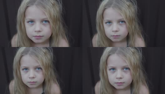 一个白头发小女孩脸上的悲伤表情。孩子忧伤的眼神。特写镜头。高清在线视频素材下载