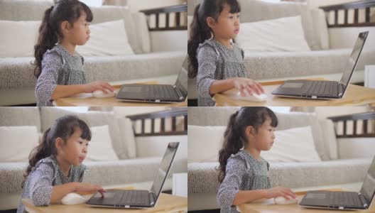 小女孩在家用笔记本电脑在线学习高清在线视频素材下载