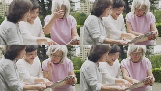中国女性朋友看旅游手册高清在线视频素材下载