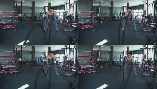 美丽的亚洲男性玩健身在健身房高清在线视频素材下载