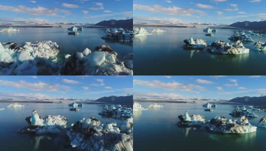 4K空中电影飞越冰川碎片泻湖，冰岛Jokulsarlon高清在线视频素材下载