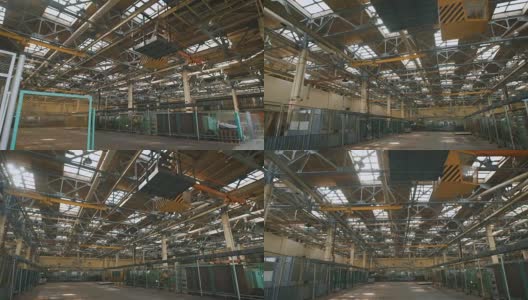 生产场所有很高的天花板和大量的工业设备遍布全港。许多金属结构、通风管道用于建筑施工。屋顶上的大采光窗白天用于照明高清在线视频素材下载