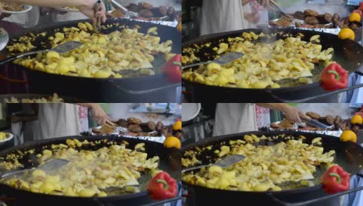 人们在热锅上拿起土豆高清在线视频素材下载