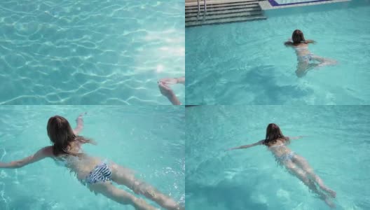 美丽的白人模特，年轻的女人是游泳在一个酒店的蓝色的水，在开放的天空下。放松、休假和自由的概念高清在线视频素材下载