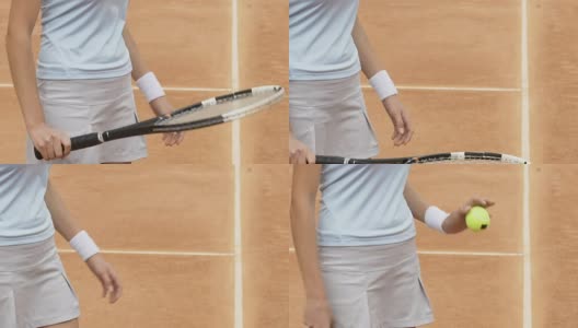女孩用球拍打网球，在场上热身，近距离高清在线视频素材下载