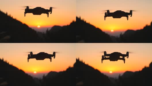 无人机在橙色的夕阳下飞行高清在线视频素材下载