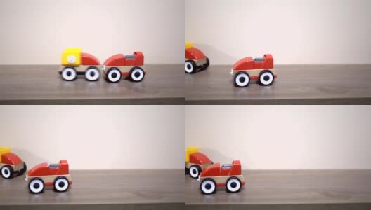 孩子在后院玩红色的玩具车。高清在线视频素材下载