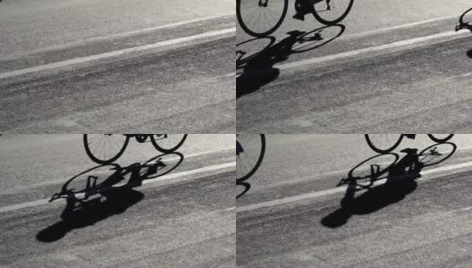 在职业比赛中骑自行车的慢动作的影子高清在线视频素材下载