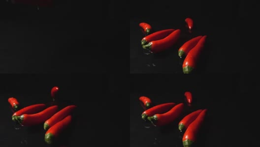 红辣椒飘落并溅起水花高清在线视频素材下载