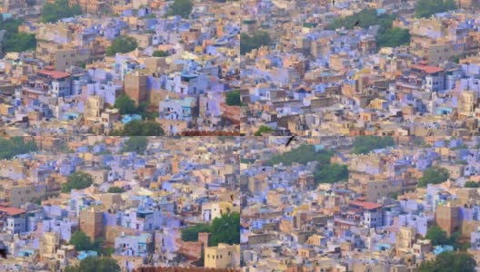 焦特布尔的蓝色城市鸟瞰图。从印度拉贾斯坦邦梅兰加尔堡(Mehrangarh Fort)俯瞰，清晨婆罗门住宅上空，蓝色的房屋和鸟儿在飞翔。相机水平锅高清在线视频素材下载