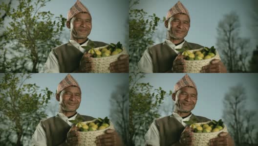 尼泊尔人民:快乐的农民拿着新鲜的柠檬篮子。高清在线视频素材下载