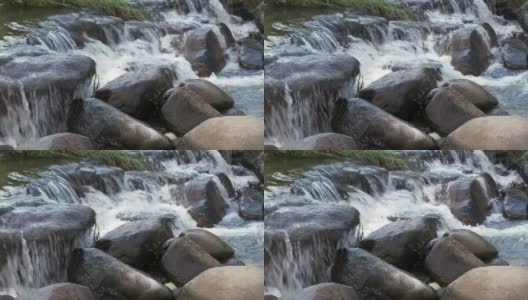 自然花园公园里流水淙淙的小溪高清在线视频素材下载