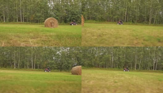 农夫骑着四轮脚踏车穿过田野高清在线视频素材下载