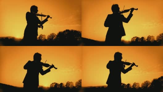 HD:在日落时拉小提琴高清在线视频素材下载