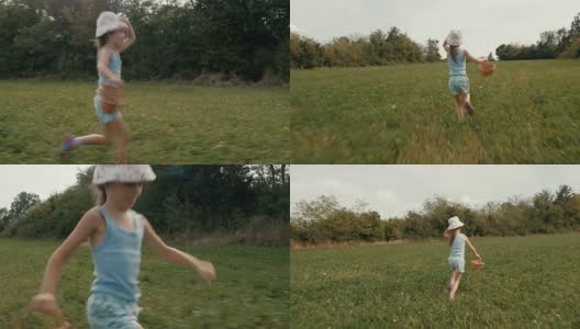 一个女孩在夏天的绿地上奔跑。真实的人，乡村场景。高清在线视频素材下载