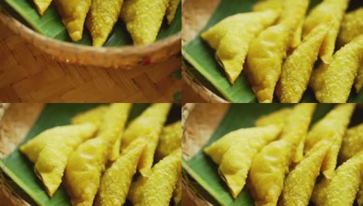 开胃煎饺装在脱粒篮子里的香蕉叶上，是泰国北部的传统美食。高清在线视频素材下载
