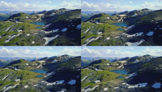 飞向山顶上的雪片，隐没的湖泊映入眼帘高清在线视频素材下载