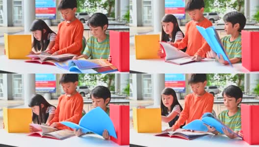 一群亚洲孩子一起读书高清在线视频素材下载