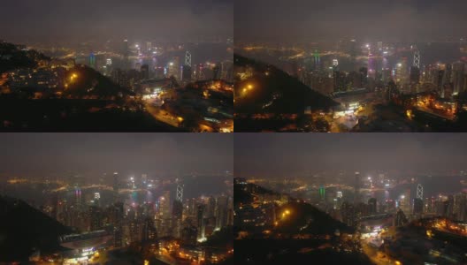 夜间照亮香港市景维多利亚山顶空中全景4k高清在线视频素材下载