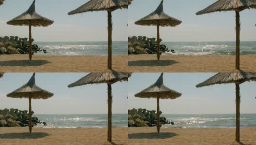 阳光沙滩上的雨伞高清在线视频素材下载