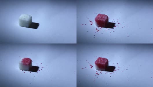 红色液体滴在一块糖上高清在线视频素材下载