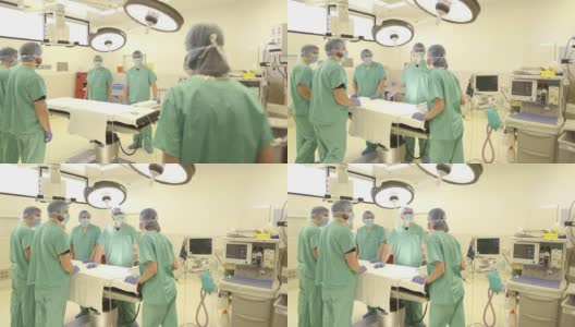 女性外科医生在手术台上为手术团队做简报高清在线视频素材下载